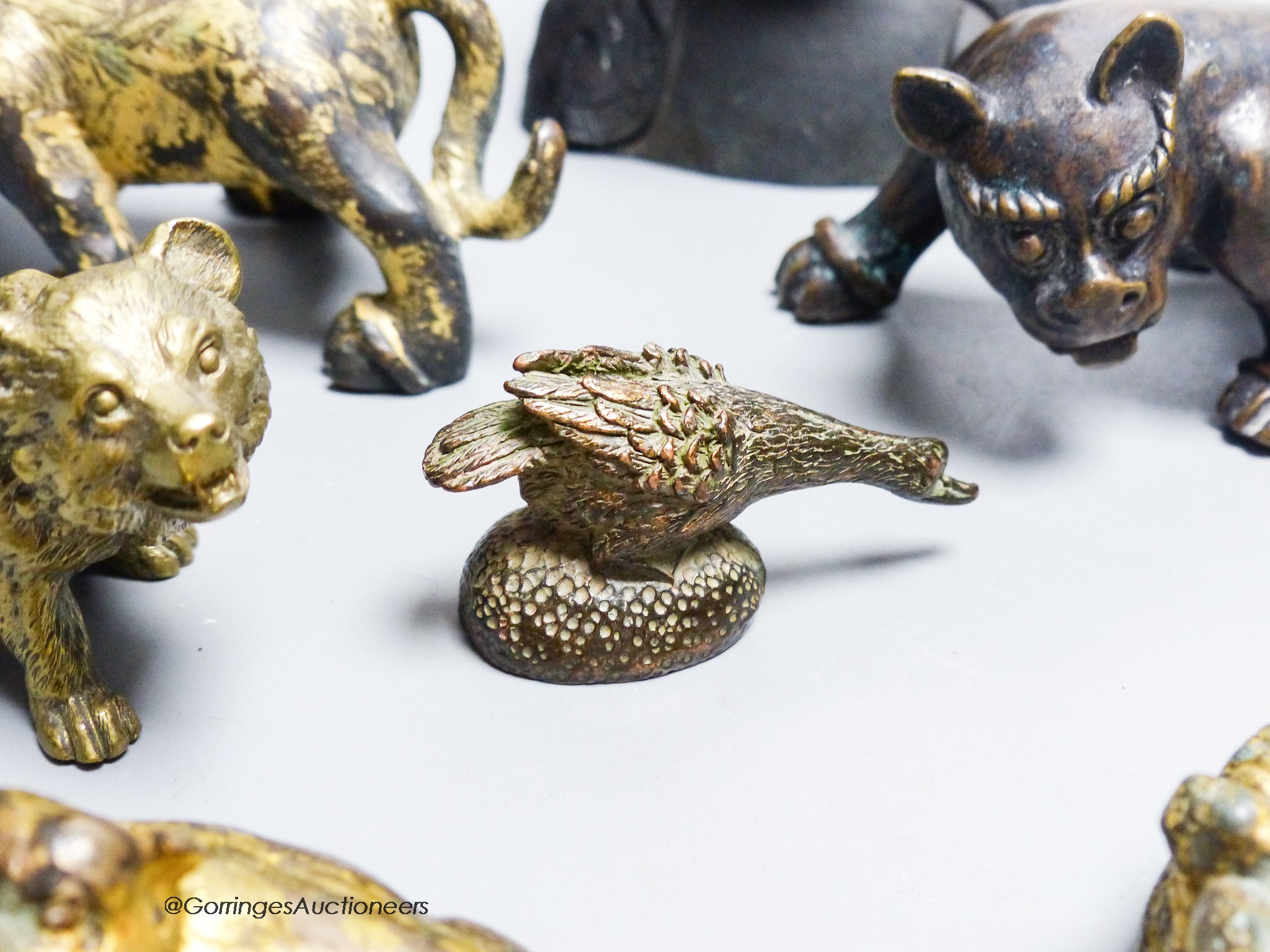 A group of nine Chinese and Oriental bronze figures to include five Han Dynasty style bronzes, tallest 12cm